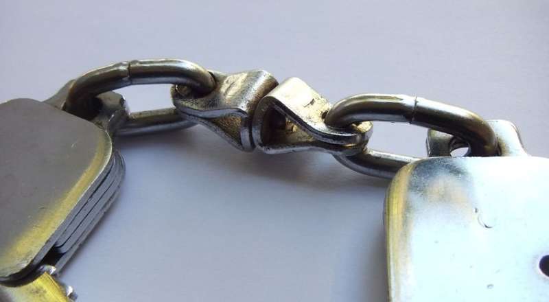 A SUPER COOL VINTAGE PAIR OF STAMPED GENUINE SAP HANDCUFFS IN GREAT WORKING CONDITION WITH KEYS !!