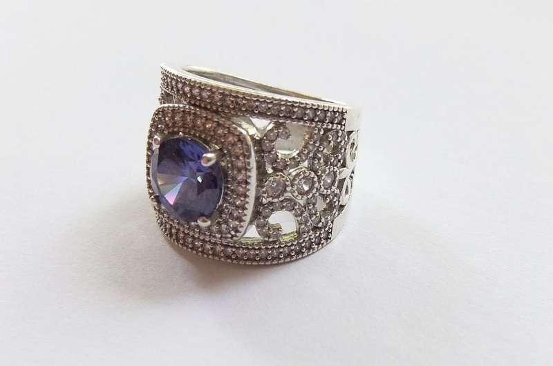 AN INCREDIBLE SOLID STERLING SILVER HALO RING SET WITH LOTS OF FACETED STONES !! MUST HAVE QUALITY !