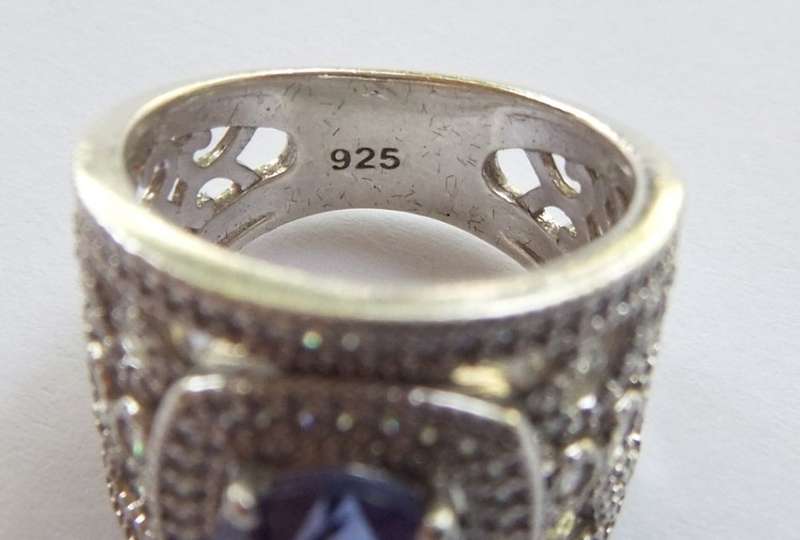 AN INCREDIBLE SOLID STERLING SILVER HALO RING SET WITH LOTS OF FACETED STONES !! MUST HAVE QUALITY !