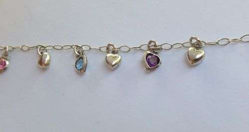 WOW !! AN EYE CATCHING SOLID STERLING SILVER CHARM BRACELET WITH ALLOT OF HEART !! I MEAN HEARTS !!