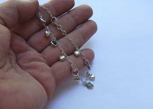 WOW !! AN EYE CATCHING SOLID STERLING SILVER CHARM BRACELET WITH ALLOT OF HEART !! I MEAN HEARTS !!