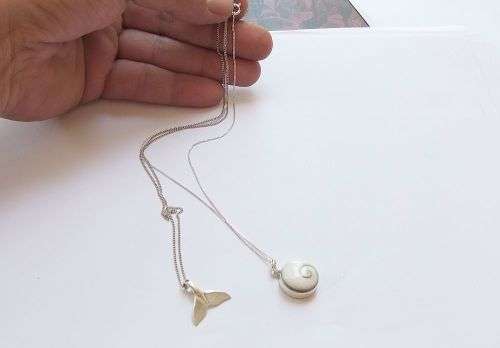 GENUINE SHELL & A WHALE TAIL !! TWO STERLING SILVER NECKLACES AND TWO STERLING SILVER PENDANTS !!