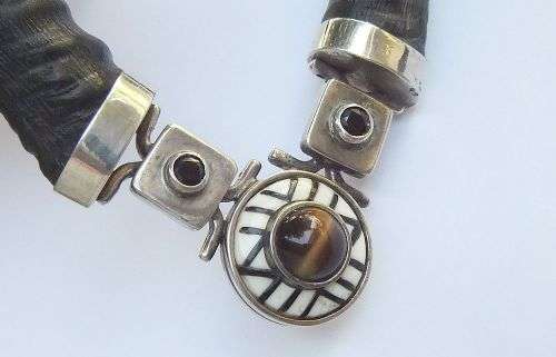 A ONE OF A KIND BUCK HORN , BONE , TIGERS EYE , BLACK STONE AND STERLING SILVER NECKLACE !!