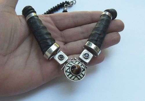 A ONE OF A KIND BUCK HORN , BONE , TIGERS EYE , BLACK STONE AND STERLING SILVER NECKLACE !!