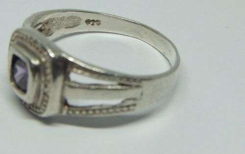 KYK !! A LOVELY SOLID STERLING SILVER RING SET WITH A SINGLE FACETED PURPLE STONE !! FULLY TESTED !!