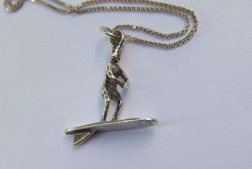 A UNIQUE OLD SOLID STERLING SILVER SURFER PENDANT WITH A STERLING SILVER NECKLACE !! SWEET DEAL !!