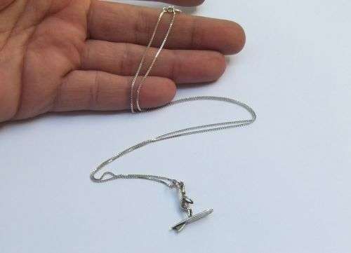 A UNIQUE OLD SOLID STERLING SILVER SURFER PENDANT WITH A STERLING SILVER NECKLACE !! SWEET DEAL !!
