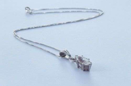 AN ELEGANT STERLING SILVER PENDANT SET WITH A MARQUISE CUT STONE PLUS A STERLING SILVER NECKLACE !!