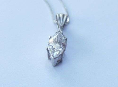 AN ELEGANT STERLING SILVER PENDANT SET WITH A MARQUISE CUT STONE PLUS A STERLING SILVER NECKLACE !!