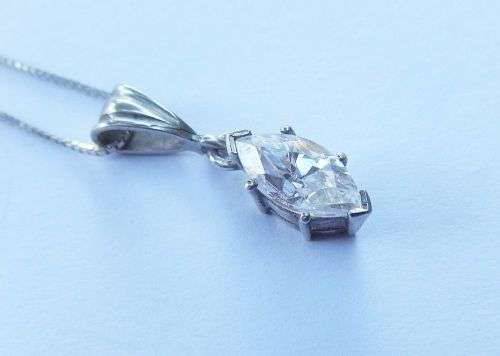 AN ELEGANT STERLING SILVER PENDANT SET WITH A MARQUISE CUT STONE PLUS A STERLING SILVER NECKLACE !!
