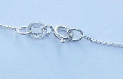 AN ELEGANT STERLING SILVER PENDANT SET WITH A MARQUISE CUT STONE PLUS A STERLING SILVER NECKLACE !!
