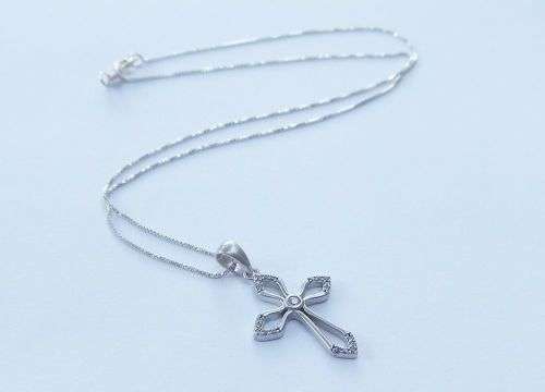 A DAINTY STERLING SILVER NECKLACE AND STERLING SILVER CROSS SET WITH FACETED STONES !!FREE COMBINING