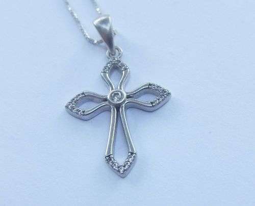 A DAINTY STERLING SILVER NECKLACE AND STERLING SILVER CROSS SET WITH FACETED STONES !!FREE COMBINING