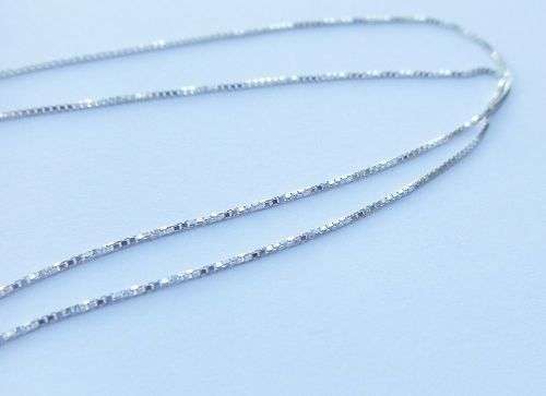 A DAINTY STERLING SILVER NECKLACE AND STERLING SILVER CROSS SET WITH FACETED STONES !!FREE COMBINING