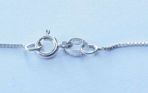 A DAINTY STERLING SILVER NECKLACE AND STERLING SILVER CROSS SET WITH FACETED STONES !!FREE COMBINING