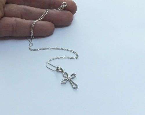 A DAINTY STERLING SILVER NECKLACE AND STERLING SILVER CROSS SET WITH FACETED STONES !!FREE COMBINING