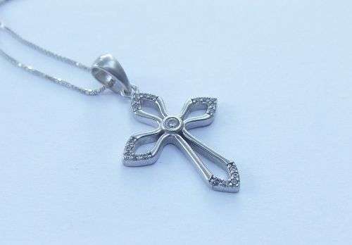 A DAINTY STERLING SILVER NECKLACE AND STERLING SILVER CROSS SET WITH FACETED STONES !!FREE COMBINING