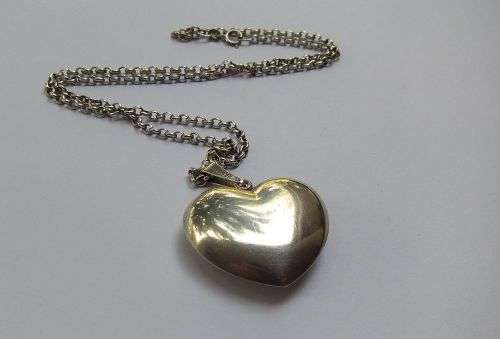 A BIG FAT STERLING SILVER HEART PENDANT WITH A STERLING SILVER NECKLACE !! GREAT DEAL !!