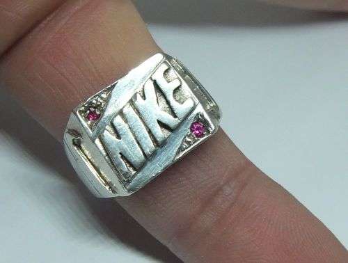R1 START !! A TOTALLY COOL SOLID STERLING SILVER ` NIKE ` THEME RING WITH FACETED STONES !! WOW !!