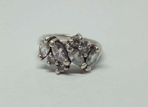 R1 START !! AN EYE CATCHING SOLID STERLING SILVER RING SET WITH FACETED CLEAR STONES !! STUNNING !!
