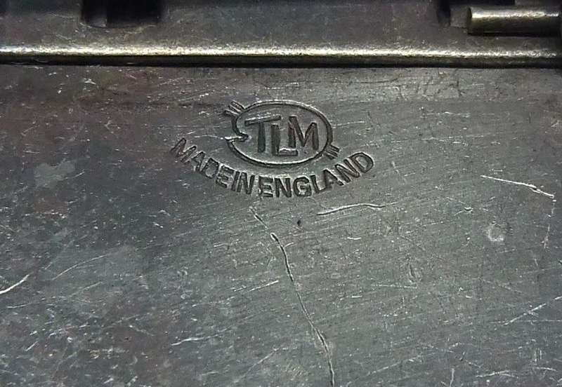 A vintage silver tone brooch designed by Thomas L Mott made in England