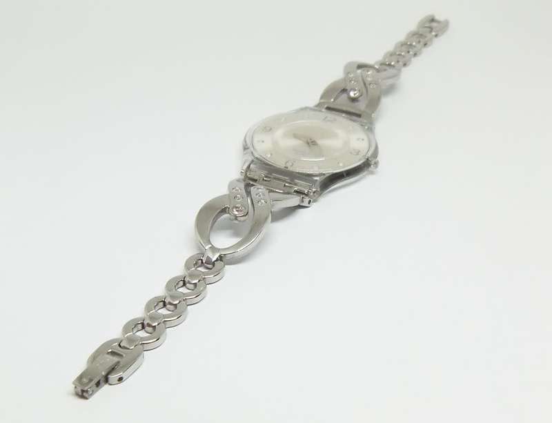 A CLASSY GENUINE SWISS SWATCH WATCH IN EXCELLENT CONDITION WITH A BRAND NEW BATTERY !! 100% AWESOME
