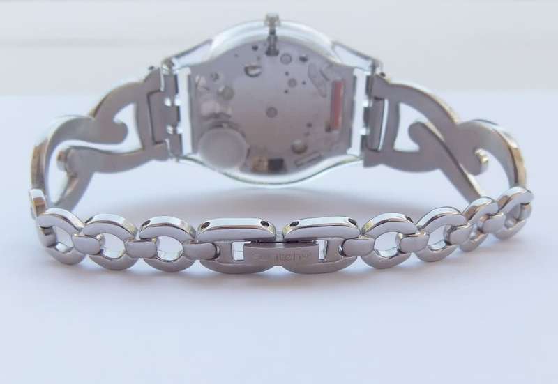 A CLASSY GENUINE SWISS SWATCH WATCH IN EXCELLENT CONDITION WITH A BRAND NEW BATTERY !! 100% AWESOME