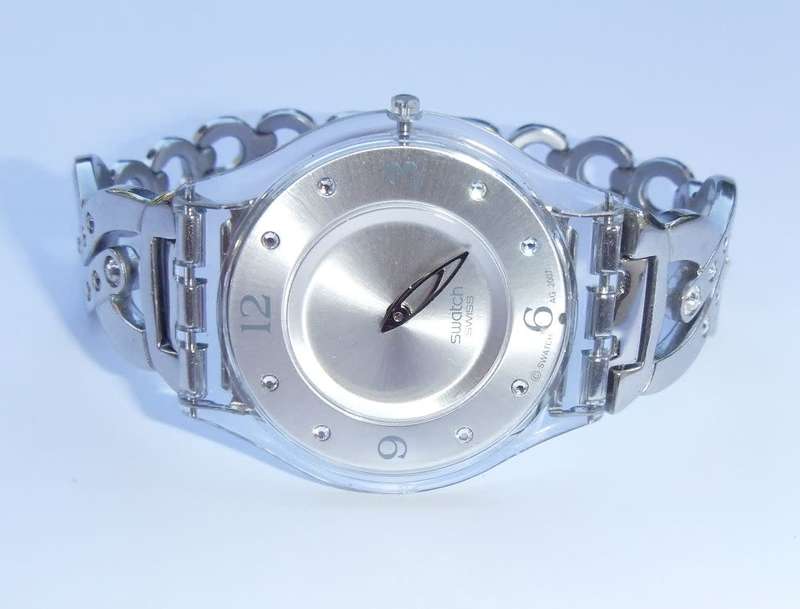 A CLASSY GENUINE SWISS SWATCH WATCH IN EXCELLENT CONDITION WITH A BRAND NEW BATTERY !! 100% AWESOME