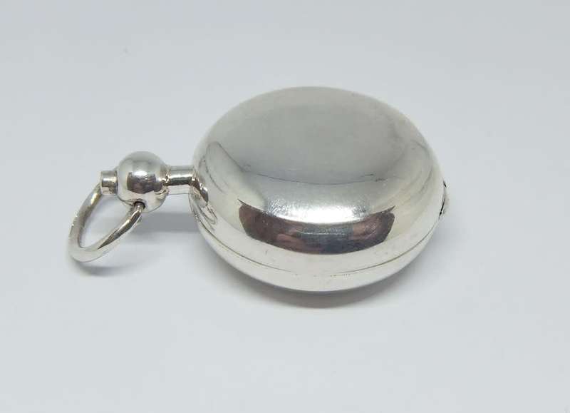 A vintage Birmingham hallmarked  sterling silver pill holder fob with spring action clip