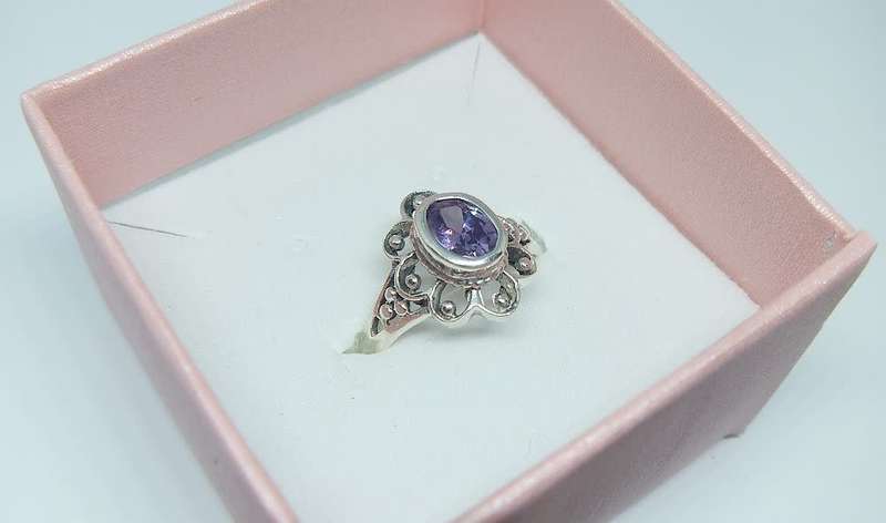 A genuine sterling silver ring with a faceted purple inset - Brand new - With gift box