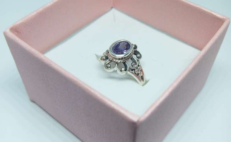 A genuine sterling silver ring with a faceted purple inset - Brand new - With gift box