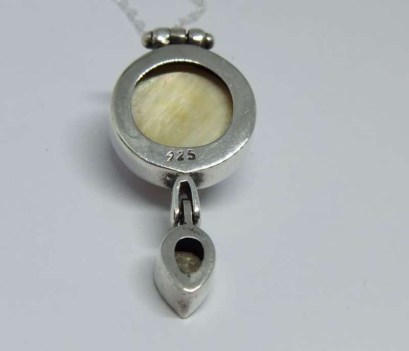 A sterling silver pendant with Mabe pearl and faceted inset plus brand new sterling silver necklace
