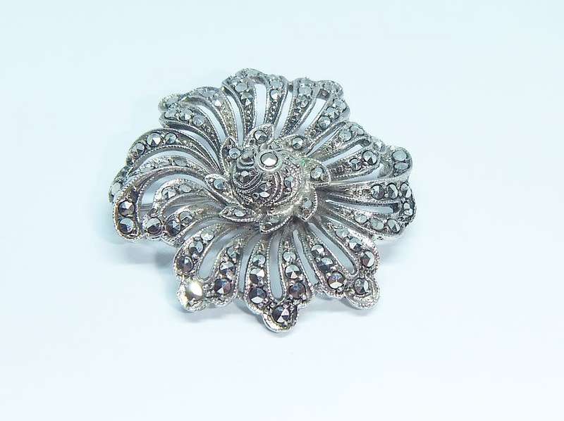A gorgeous vintage solid silver brooch filled with marcasite