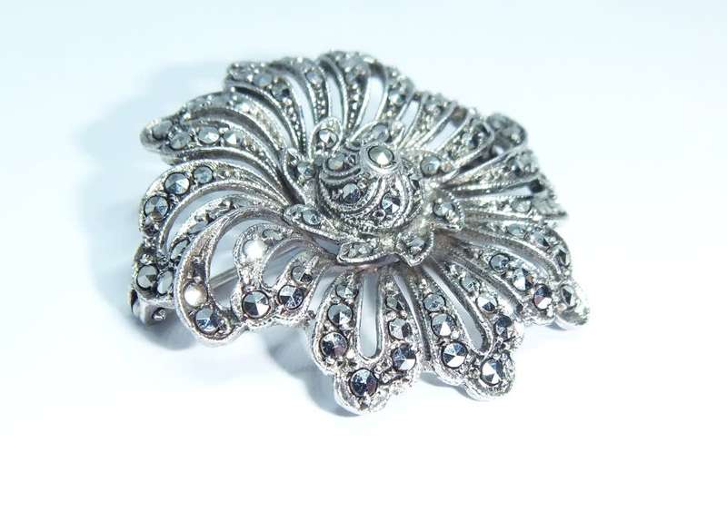 A gorgeous vintage solid silver brooch filled with marcasite