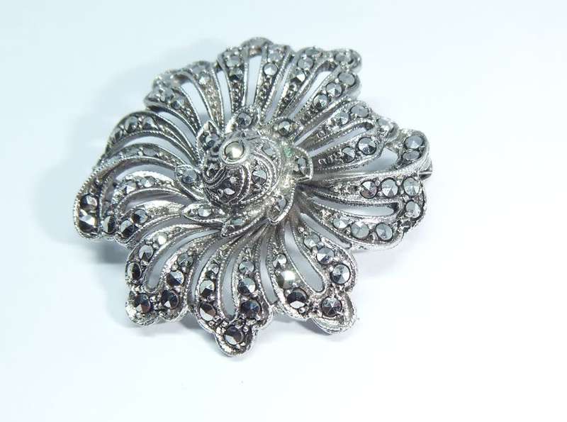 A gorgeous vintage solid silver brooch filled with marcasite