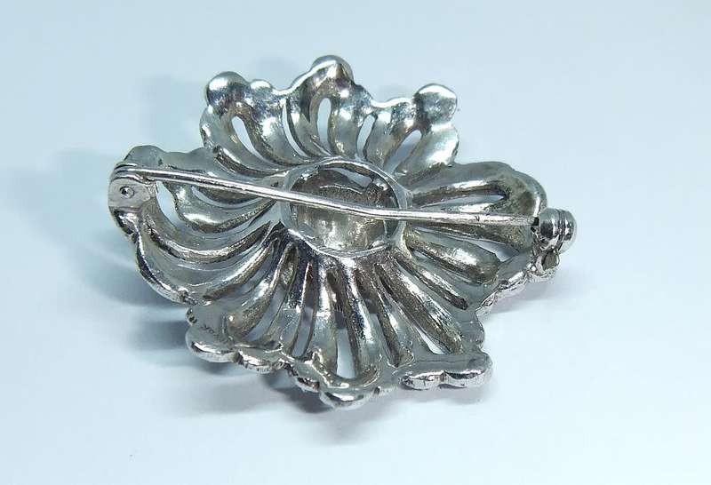 A gorgeous vintage solid silver brooch filled with marcasite