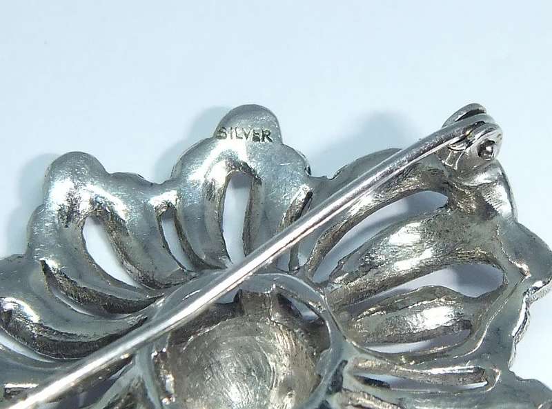 A gorgeous vintage solid silver brooch filled with marcasite
