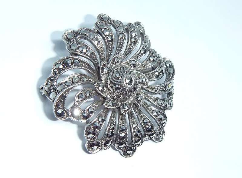 A gorgeous vintage solid silver brooch filled with marcasite