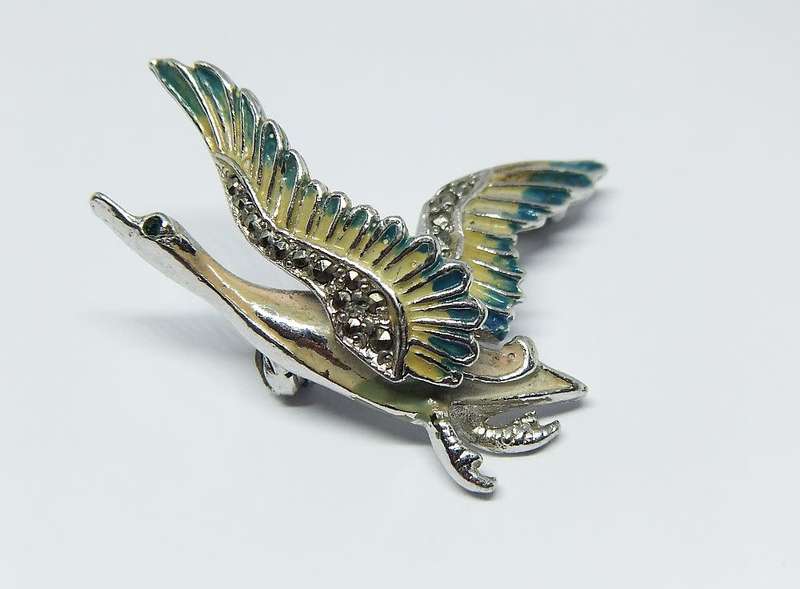 A lovely vintage 1950`s enamel Swan brooch by design house BJL set with marcasite