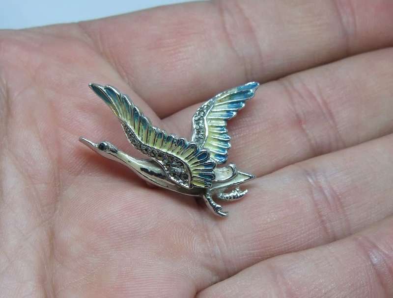 A lovely vintage 1950`s enamel Swan brooch by design house BJL set with marcasite