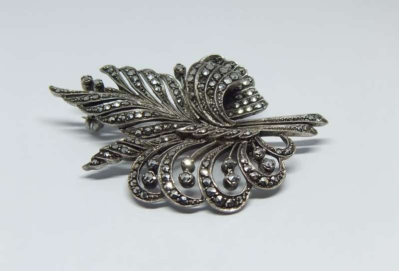 A magnificent vintage solid sterling silver leaf form brooch filled with marcasite