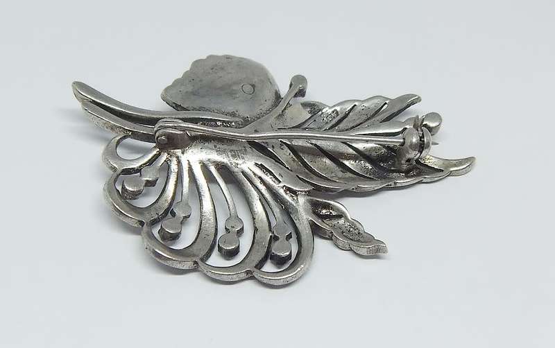 A magnificent vintage solid sterling silver leaf form brooch filled with marcasite