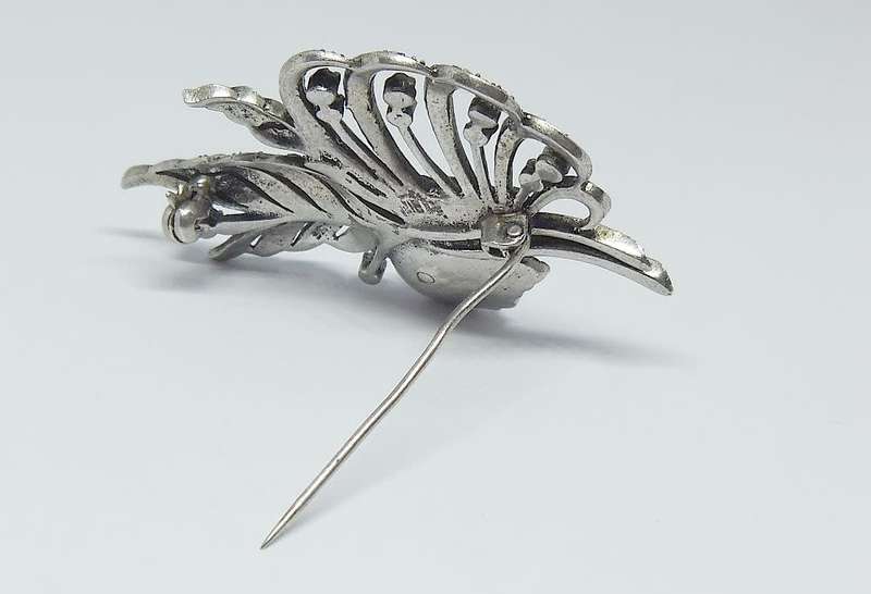 A magnificent vintage solid sterling silver leaf form brooch filled with marcasite