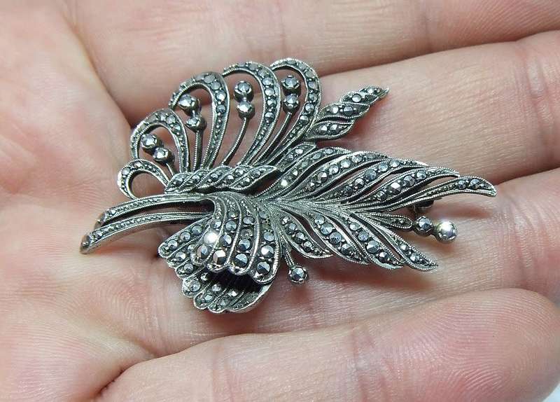 A magnificent vintage solid sterling silver leaf form brooch filled with marcasite