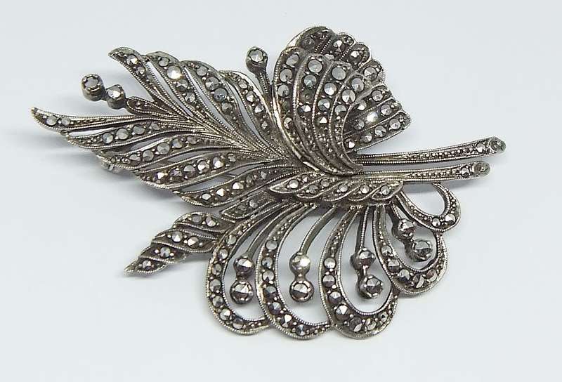 A magnificent vintage solid sterling silver leaf form brooch filled with marcasite