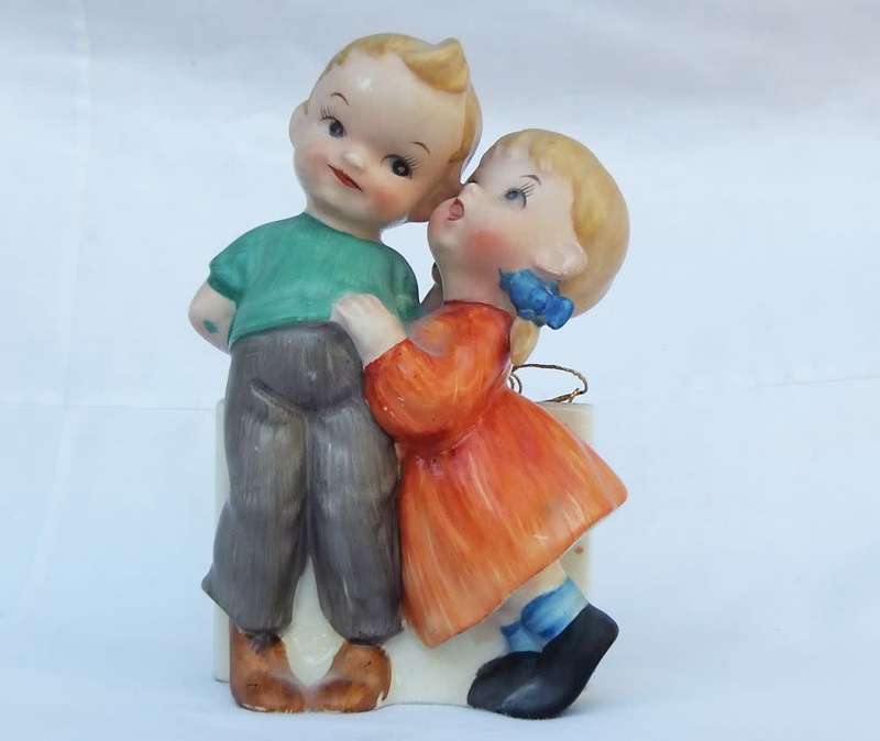 A very charming vintage Hummel look wall pocket or wall vase