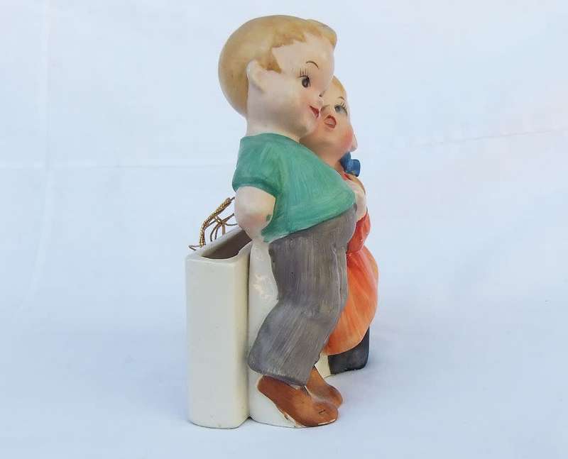A very charming vintage Hummel look wall pocket or wall vase