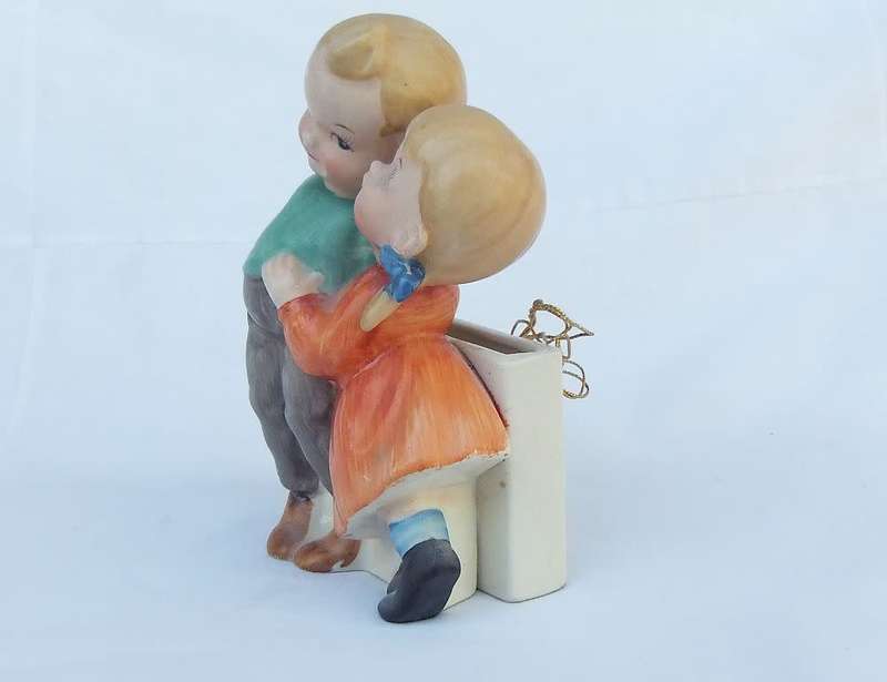 A very charming vintage Hummel look wall pocket or wall vase