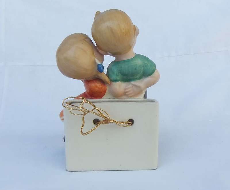A very charming vintage Hummel look wall pocket or wall vase