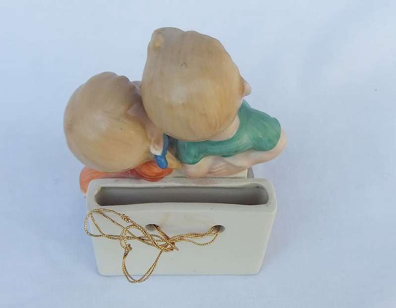 A very charming vintage Hummel look wall pocket or wall vase